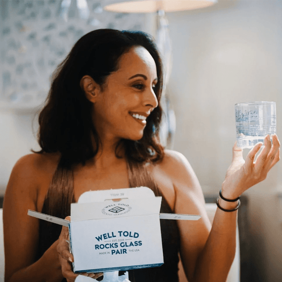 Woman holding Well Told Rocks Glass