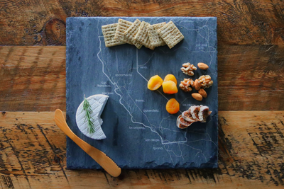 Custom slate cheese board with an engraved State